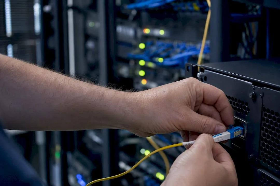 Hands connecting a security device hardware